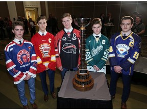 From left; Calgary Buffalos captain Justin Ross, Calgary Flames captain Brayden Morrison, Airdrie CFR Bisons captain Jett Jones, Calgary Northstars captain Spencer Weinkuaf and Calgary Royals captain Ethan Jamernik  pose with the Mac's Tournament trophy at the Westin Hotel on Wednesday December 19, 2018. The five captains were on hand for the announcement of the five pools for this year's hockey tournament. Gavin Young/Postmedia