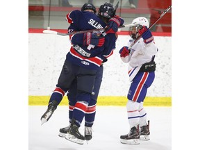 Regina Pat Canadians Johnny Carmichael and Cole Sillinger celebrate a go-ahead goal late in the third period  during AAA Mac's Midget Hockey Tournament action at Father David Bauer in Calgary on Sunday December 30, 2018. Vancouver NE Chefs tied the game with about 30 seconds remaining and the game ended in a 4-4 tie. Jim Wells/Postmedia
