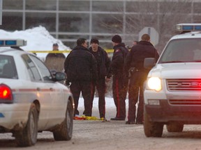 Calgary police investigate a shooting scene that left three people dead after shots were fire inside and outside the Bolsa Vietnamese restaurant at 94th Avenue and Bonaventure Drive SE.  STUART DRYDEN Sun Media