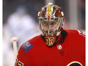 Calgary Flames goalie David Rittich warms up before a recent game. Photo by Darren Makowichuk/Postmedia.