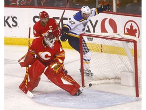 Calgary Flames goalie Mike Smith gets scored on by St. Louis Blues David Perron in first period action at the Scotiabank Saddledome in Calgary on Saturday December 22, 2018. Darren Makowichuk/Postmedia