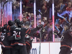 Team Canada players celebrates Morgan Frost's goal against team Finland during first period IIHF exhibition hockey action at Rogers Arena in Vancouver, Sunday, Dec. 23, 2018.