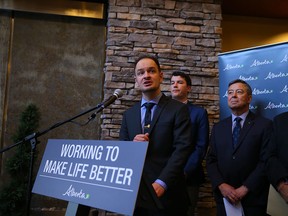 Service Alberta Minister Brian Malkinson speaks at a news conference in Calgary Friday.