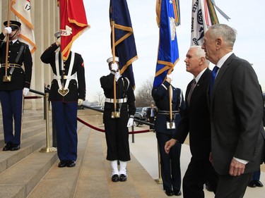 Defense Secretary Jim Mattis welcomes Vice President Mike Pence to the Pentagon, Wednesday, Dec. 19, 2018.