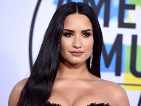 In this Nov. 19, 2017, file photo, Demi Lovato arrives at the American Music Awards at the Microsoft Theater in Los Angeles.
