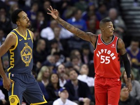 Raptors Delon Wright, right, Raptors celebrates in front of Warriors Shaun Livingston during Toronto’s impressive win on Wednesday. GETTY IMAGES