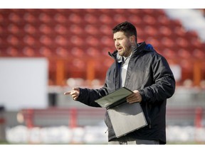 Runningbacks coach Brent Monson calls a play during a Calgary Stampeders practice at McMahon Stadium in Calgary, Alta. on Wednesday, Nov. 19, 2014. The Stamps will host the Edmonton Eskimos in the CFL's West Division final on Sunday. Lyle Aspinall/Calgary Sun/QMI Agency