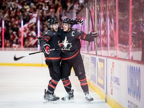 Canada's Jared McIsaac, left, and Maxime Comtois celebrate Comtois' goal against the Czech Republic during first period IIHF world junior hockey championship action in Vancouver, on Saturday December 29, 2018.