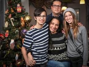 Guillermo Rojas Vertiz and his wife Irma Canut pose for a photo with their two children, son, Guillermo, 12, and daughter, Constanza, 15, in their Okotoks home. The young family has jumped through dozens of immigration hoops over two years and spent more than $1 million establishing their lives and business in Canada.  Al Charest/Postmedia