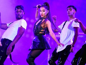 In this June 2, 2018 file photo, Ariana Grande, centre, performs at Wango Tango in Los Angeles.