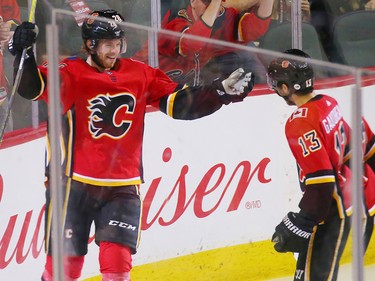 Calgary Flames Elias Lindholm, left and Johnny Gaudreau celebrate after teaming up to score their second goal during NHL action against the Minnesota Wild at the Scotiabank Saddledome in Calgary on Thursday December 6, 2018. Gaudreau assisted on both of Lindholm's goals.