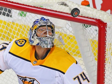 Nashville Predators goaltender Juuse Saros tracks the puck on a Calgary Flames shot during NHL action at the Scotiabank Saddledome in Calgary on Saturday December 8, 2018.