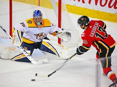 Calgary Flames forward Johnny Gaudreau lines up a shot on Nashville Predators goaltender Juuse Saros during NHL action at the Scotiabank Saddledome in Calgary on Saturday December 8, 2018.