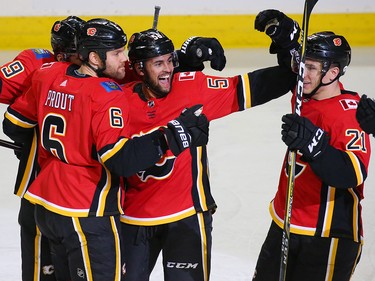 The Calgary Flames celebrate Garnet Hathaway's goal on Nashville Predators goaltender Juuse Saros in NHL action at the Scotiabank Saddledome in Calgary on Saturday December 8, 2018.