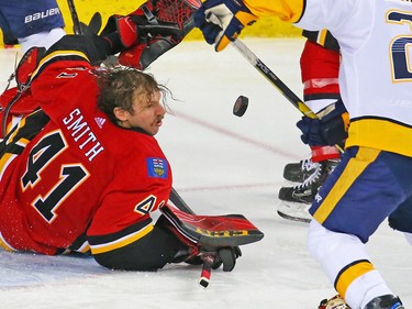 Calgary Flames goaltender Mike Smith loses his helmet during NHL action against the Nashville Predators at the Scotiabank Saddledome in Calgary on Saturday December 8, 2018.