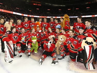 The Calgary Hitmen have some fun with the thousands of teddy bears during the 24th annual Brick Teddy Bear Toss game against the Kamloops Blazers at the Scotiabank Saddledome in Calgary on Sunday December 9, 2018.