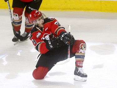 Calgary Hitmen Kaden Elder scores on Kamloops Blazers goalie Dylan Garand to start the bear toss during the 24th annual Brick Teddy Bear Toss game at the Scotiabank Saddledome in Calgary on Sunday December 9, 2018.