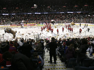 Calgary Hitmen Kaden Elder scores on Kamloops Blazers goalie Dylan Garand to start the bear toss during the 24th annual Brick Teddy Bear Toss game at the Scotiabank Saddledome in Calgary on Sunday December 9, 2018.