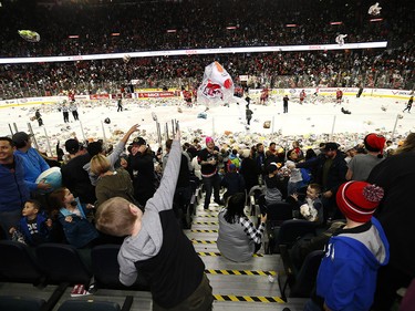 Calgary Hitmen Kaden Elder scores on Kamloops Blazers goalie Dylan Garand to start the bear toss during the 24th annual Brick Teddy Bear Toss game at the Scotiabank Saddledome in Calgary on Sunday December 9, 2018.