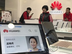 A profile of Huawei's chief financial officer Meng Wanzhou is displayed on a Huawei computer at a Huawei store in Beijing, China, Thursday, Dec. 6, 2018. Canadian authorities said Wednesday that they have arrested Meng for possible extradition to the United States.