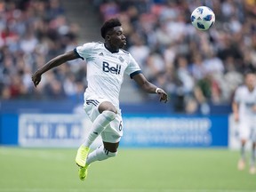Vancouver Whitecaps' Alphonso Davies receives a pass during the second half of an MLS soccer game against the Portland Timbers in Vancouver, on Sunday Oct. 28, 2018.