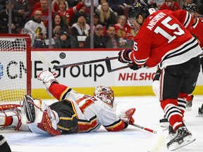Mike Smith makes a save on Artem Anisimov of the Chicago Blackhawks at the United Center on Dec. 2, 2018.
