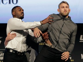Jon Jones, left, pushes Alexander Gustafsson out of the way during a news conference about their light heavyweight bout, Friday, Nov. 2, 2018, at Madison Square Garden in New York.