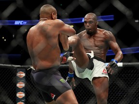 (R-L) Jon Jones kicks Daniel Cormier during the UFC 214 event at Honda Center on July 29, 2017, in Anaheim, Calif.