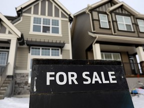 Home prices in Calgary will take another dip in 2019, according to two recent real estate reports.