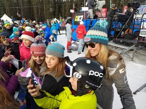 U.S. alpine racing star Mikaela Shiffrin interacts with young racing fans following her fourth-place finish at the Lake Louise Audi FIS Ski World Cup on Saturday. Photo by Patrick Gibson/Postmedia Network.