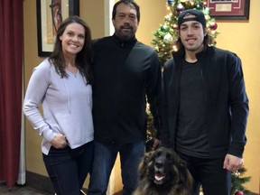 Calgary Flames forward call-up Ryan Lomberg, right, hangs out with his proud parents Lori and Trevor and his dog, Mia, at a hotel in Columbus, Ohio. (Supplied photo)