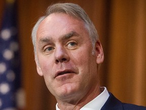 In this Dec. 11, 2018 file photo, U.S. Secretary of the Interior Ryan Zinke speaks after an order withdrawing federal protections for countless waterways and wetland was signed, at EPA headquarters in Washington.