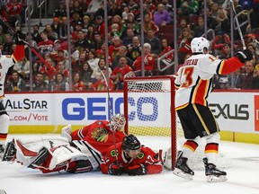 Flames Johnny Gaudreau scores  against Collin Delia of the Chicago Blackhawks at the United Center on Jan. 07, 2019 in Chicago.