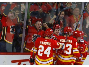 Calgary Flames celebrate a goal on the Edmonton Oilers in NHL hockey action at the Scotiabank Saddledome in Calgary, Alta. on Saturday November 17, 2018. Leah Hennel/Postmedia