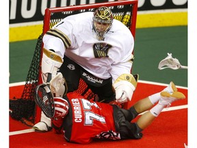 Calgary Roughnecks Zach Currier collides with Vancouver Warriors goalie Aaron Bold during their game at the Scotiabank Saddledome in Calgary, on Saturday December 15, 2018. Leah Hennel/Postmedia ORG XMIT: POS1812152108552385