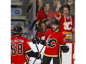 Calgary Flames Michael Frolik, right, celebrates his goal on Florida Panthers with teammate Oliver Kylington in NHL hockey action at the Scotiabank Saddledome in Calgary, on Friday January 11, 2019. Leah Hennel/Postmedia