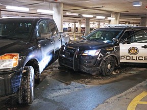Unmarked police vehicles pin a stolen Calgary police Ford Explorer in the underground parking lot at SAIT on Monday afternoon Jan. 21, 2019.