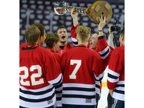 The St. Albert Raiders celebrate after winning the Mac's AAA Midget Tournament final at the Scotiabank Saddledome in Calgary on Tuesday, January 1, 2019. Al Charest/Postmedia