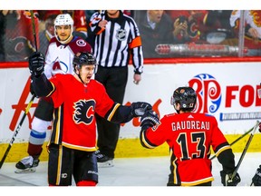 Calgary Flames forward Mikael Backlund celebrates with teammate Johnny Gaudreau after scoring against the Colorado Avalanche in NHL hockey at the Scotiabank Saddledome in Calgary on Wednesday. Photo by Al Charest/Postmedia