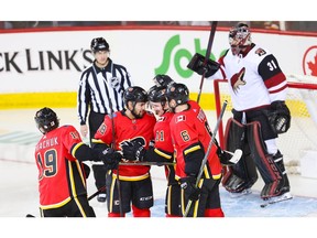 Calgary Flames Matthew Tkachuk celebrates with teammates after scoring against the Arizona Coyotes in NHL hockey at the Scotiabank Saddledome in Calgary on Sunday, January 13, 2019. Al Charest/Postmedia