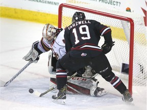 The Rebels' Josh Tarzwell can't handle the rebound in front of Hitmen goalie Jack McNaughton during WHL hockey action between the Red Deer Rebels and the Calgary Hitmen in Calgary on Friday, January 4, 2019. Jim Wells/Postmedia