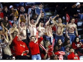 Fans were cheering loud as the men's UCalgary Dinos battled the MRU Cougars as the Calgary Flames hosted the Crowchild Classic at the Scotiabank Saddledome last night. Photo by Darren Makowichuk/Postmedia.
