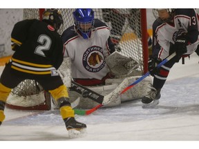 The Bow River Bruins PeeWee 4 Gold Morgan Alcock is stopped by Northwest Warriors PeeWee 4 goalie Kade Black in Semi-Final Minor Hockey Action at the Shouldice arena in Calgary on Thursday January 17, 2019. Darren Makowichuk/Postmedia
