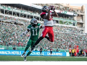 Calgary Stampeders slotback Kamar Jorden (88) catches a convert pass under pressure from Saskatchewan Roughriders defensive back Ed Gainey (11) during second half CFL action in Regina on Sunday, August 19, 2018. The Saskatchewan Roughriders defeated the Calgary Stampeders 40-27.