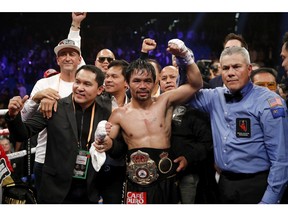 Manny Pacquiao celebrates his win against Adrien Broner in the WBA welterweight title boxing match Saturday, Jan. 19, 2019, in Las Vegas.
