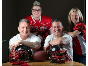 Keith Crawford, left and Wes Lysack are announced as the Western Women's Canadian Football team, Calgary Rage, head coaches in Calgary, on Thursday. Pictured with them are Rage team members Erin Walton, left and Tatrina Medvescek-Valentine. Photo by Leah Hennel/Postmedia.