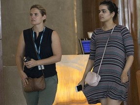 Rahaf Mohammed Alqunun, right, walks with an unidentified companion in Bangkok, Thailand, Friday, Jan. 11, 2019. Alqunun, the 18-year old Saudi woman who fled her family to seek asylum, remains in Thailand under the care of the U.N. refugee agency as she awaits a decision by a third country to accept her as a refugee.