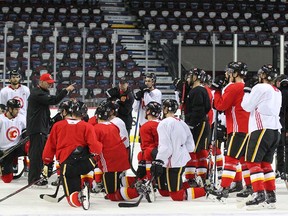 Flames coach Bill Peters instructs the team during drills at practice in Calgary on Friday, October 26, 2018. Jim Wells/Postmedia