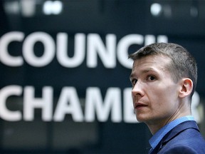 Calgary Coun Jeromy Farkas listens to media ask questions to Mayor Naheed Nenshi during an afternoon break from Council meetings in Calgary on Tuesday, January 15, 2019. Jim Wells/Postmedia