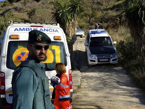 Emergency services look for a 2-year-old boy who fell into a well, in a mountainous area near the town of Totalan in Malaga, Spain, Monday, Jan. 14, 2019.